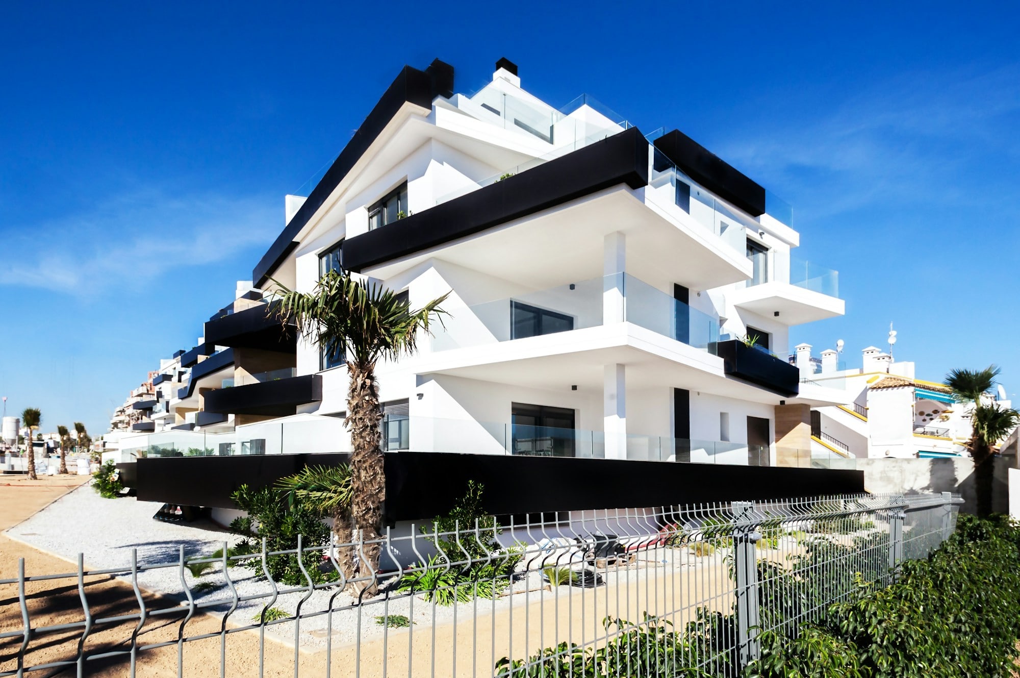 A stunning, secluded, three story modern black and white luxury home.